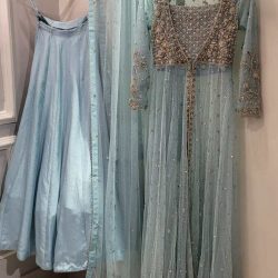 top and dupatta crafted from delicate net fabric, paired with a skirt made from luxurious Korean silk