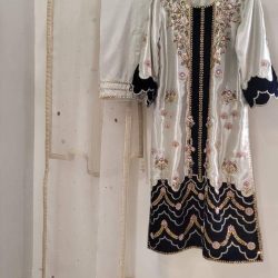 shirt made of pure lamba shimmer, paired with a Russian silk trouser and a bamber organza dupatta
