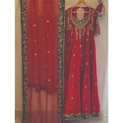 A bridal masterpiece: luxurious zari silk maxi with pure organza dupatta. Intricate kora dabaka, tilla, Swarovski crystals, resham embroidery, and precious gems create an opulent, graceful look fit for a queen on her wedding day